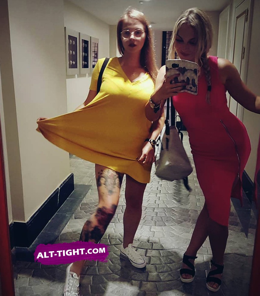 Liberal white girls showing off tattoos while posing for a selfie White leftist girls show tattoos in selfie together